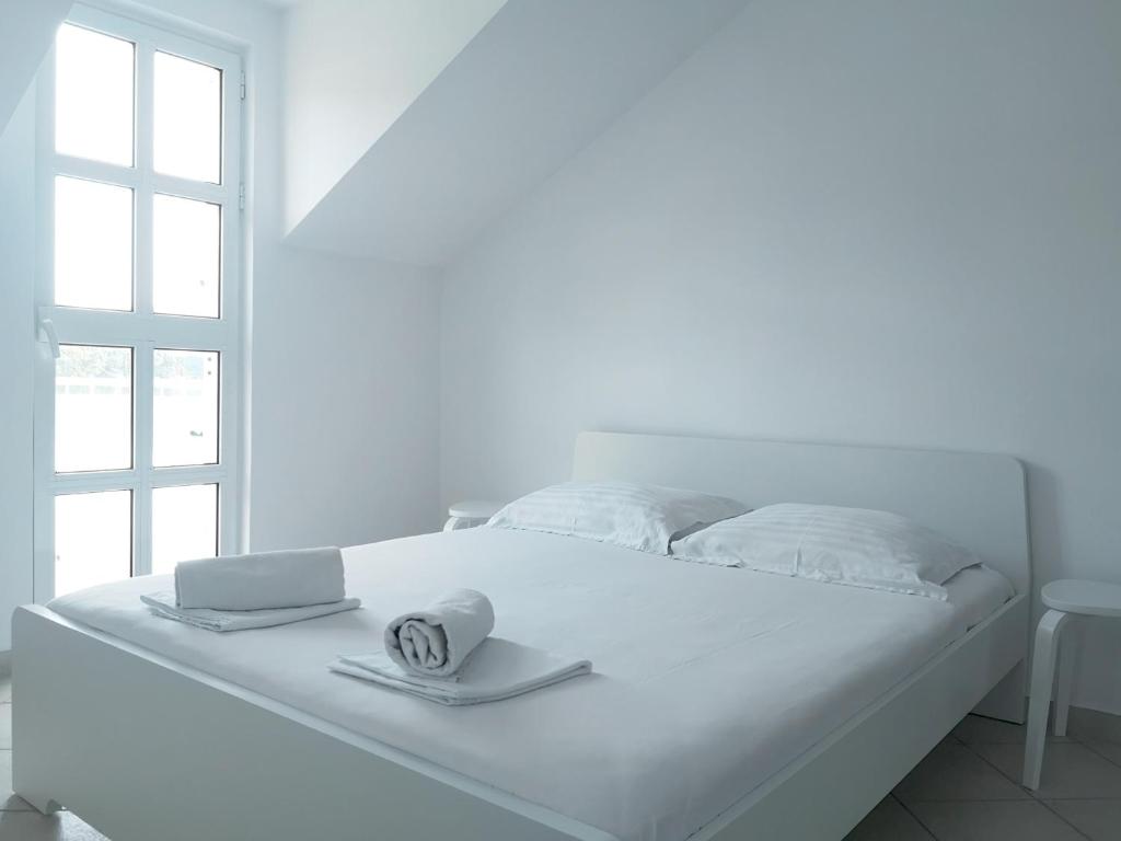 Posteľ alebo postele v izbe v ubytovaní Apartments and rooms by the sea Slano, Dubrovnik - 8737