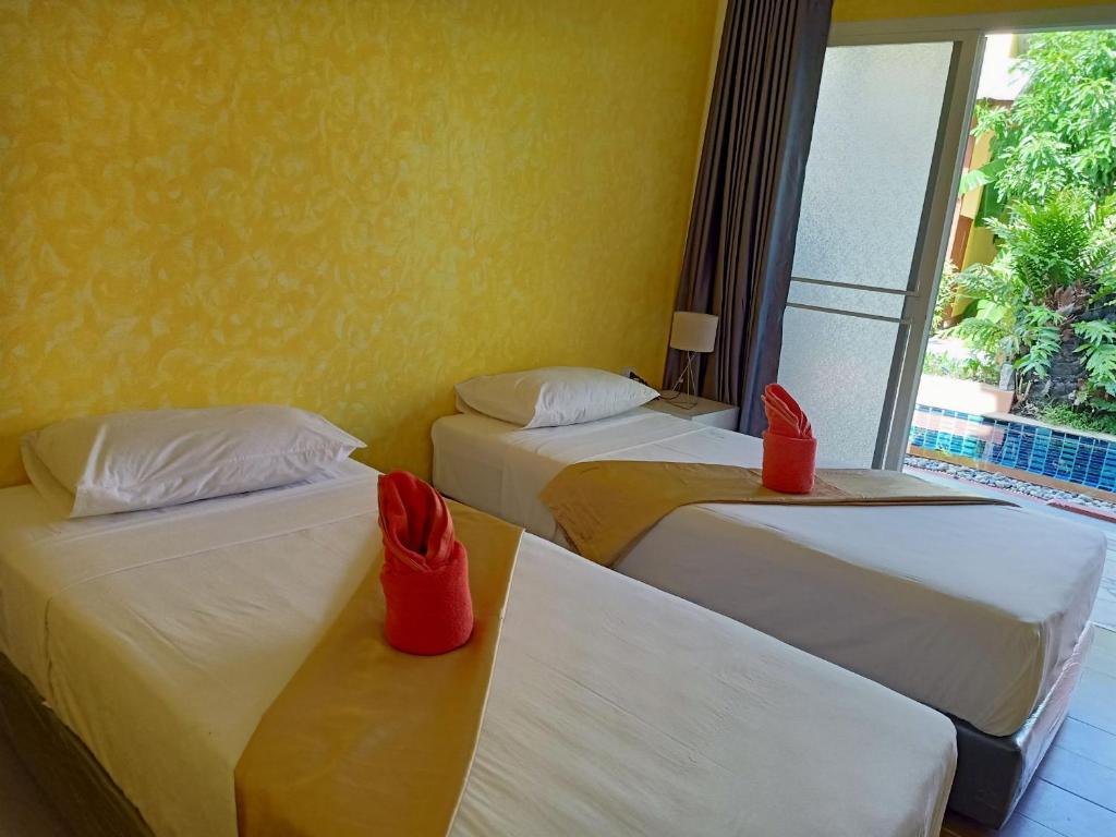 Postel nebo postele na pokoji v ubytování Ban Elephant Blanc Bungalow
