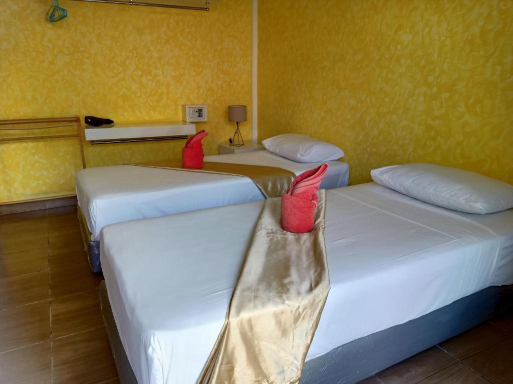 Postel nebo postele na pokoji v ubytování Ban Elephant Blanc Bungalow