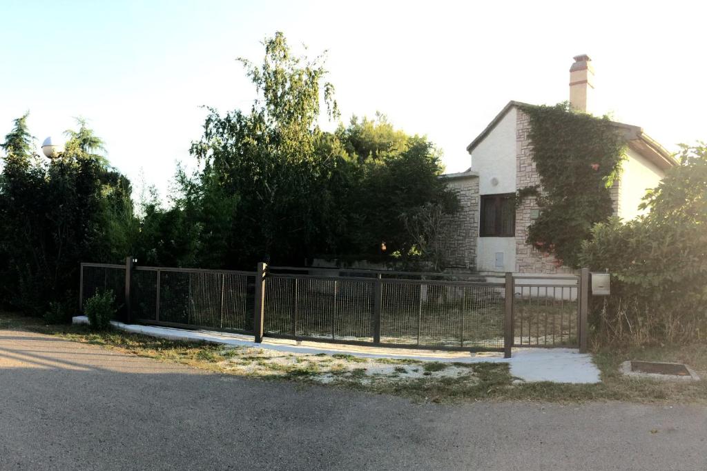 a fence in front of a house at Holiday house with a parking space Valbandon, Fazana - 11172 in Marana