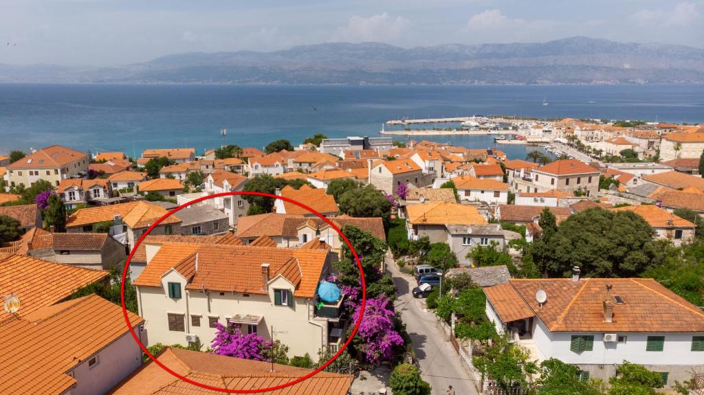 a view of a city with a red circle on it at Apartment Supetar 11278a in Supetar