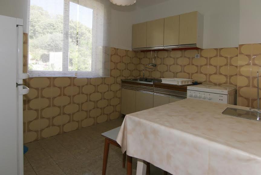 Kuchyň nebo kuchyňský kout v ubytování Apartments by the sea Pag - 11400