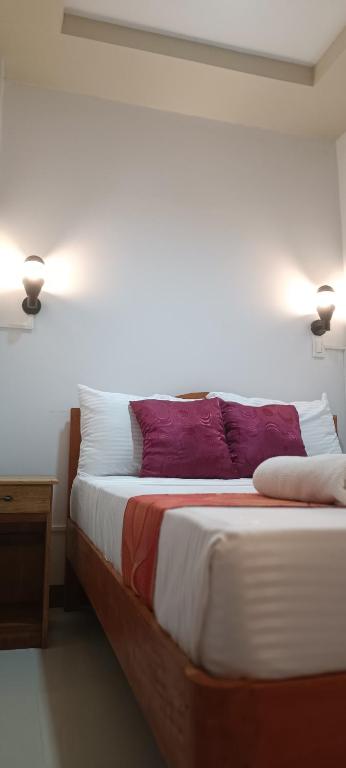 Postel nebo postele na pokoji v ubytování Layang Layang Home