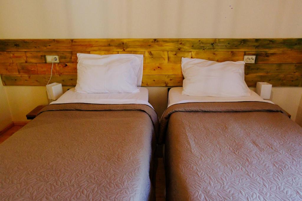 Postel nebo postele na pokoji v ubytování Hotel Ailama Mestia
