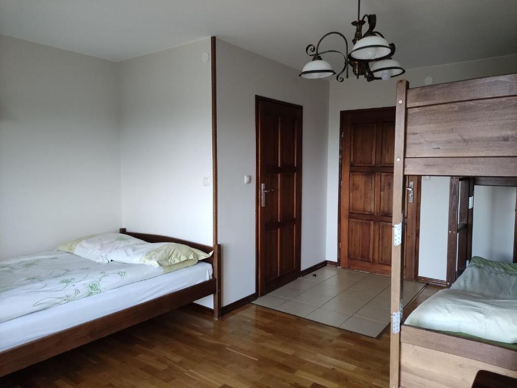 Postel nebo postele na pokoji v ubytování Pensjonat Na Wzgórzu