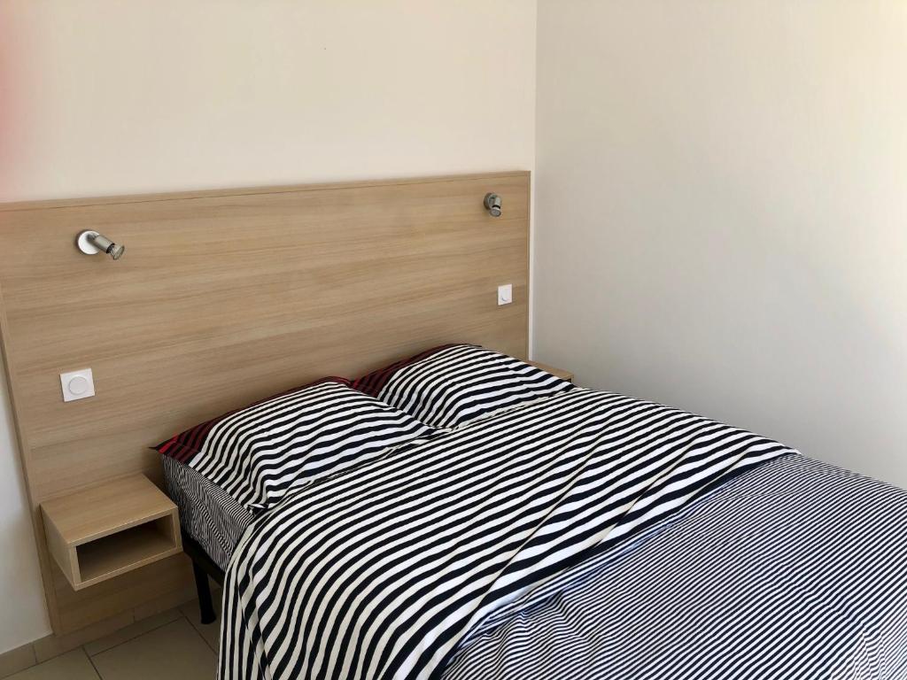 Posteľ alebo postele v izbe v ubytovaní Appartement centre ville avec piscine rooftop