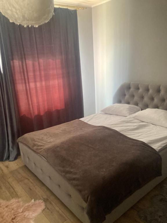 Кровать или кровати в номере Apartament na Chrobrego