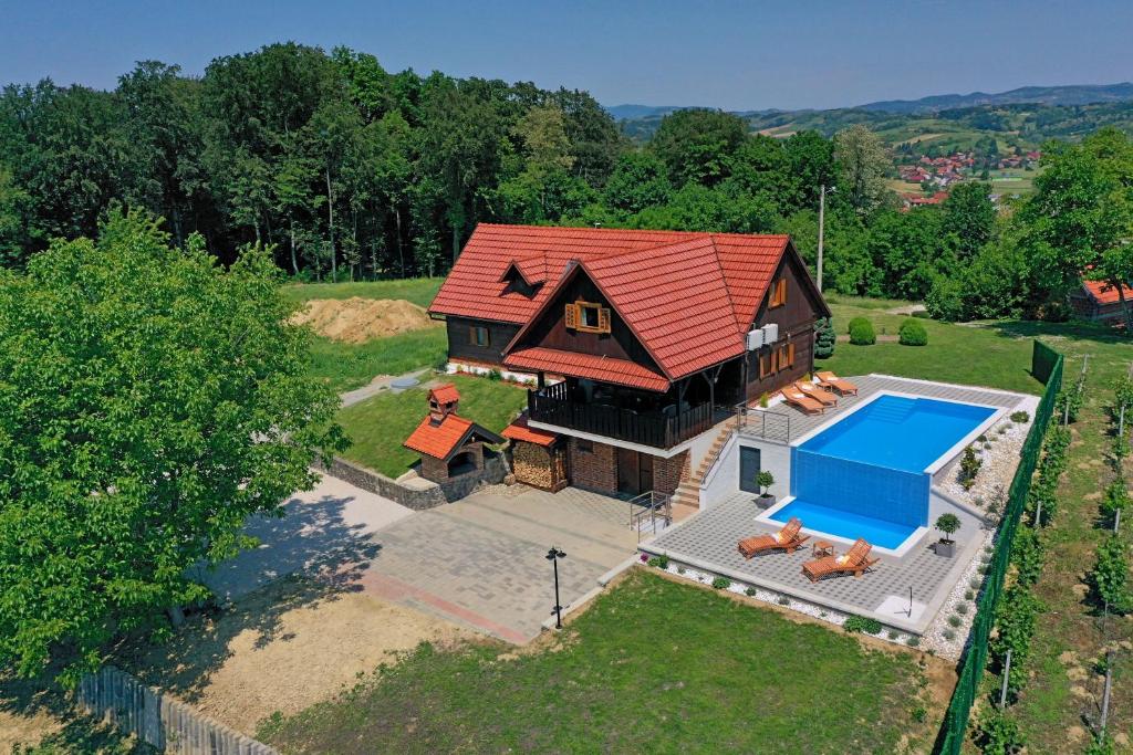 an overhead view of a house with a swimming pool at Green silence in Bedenica