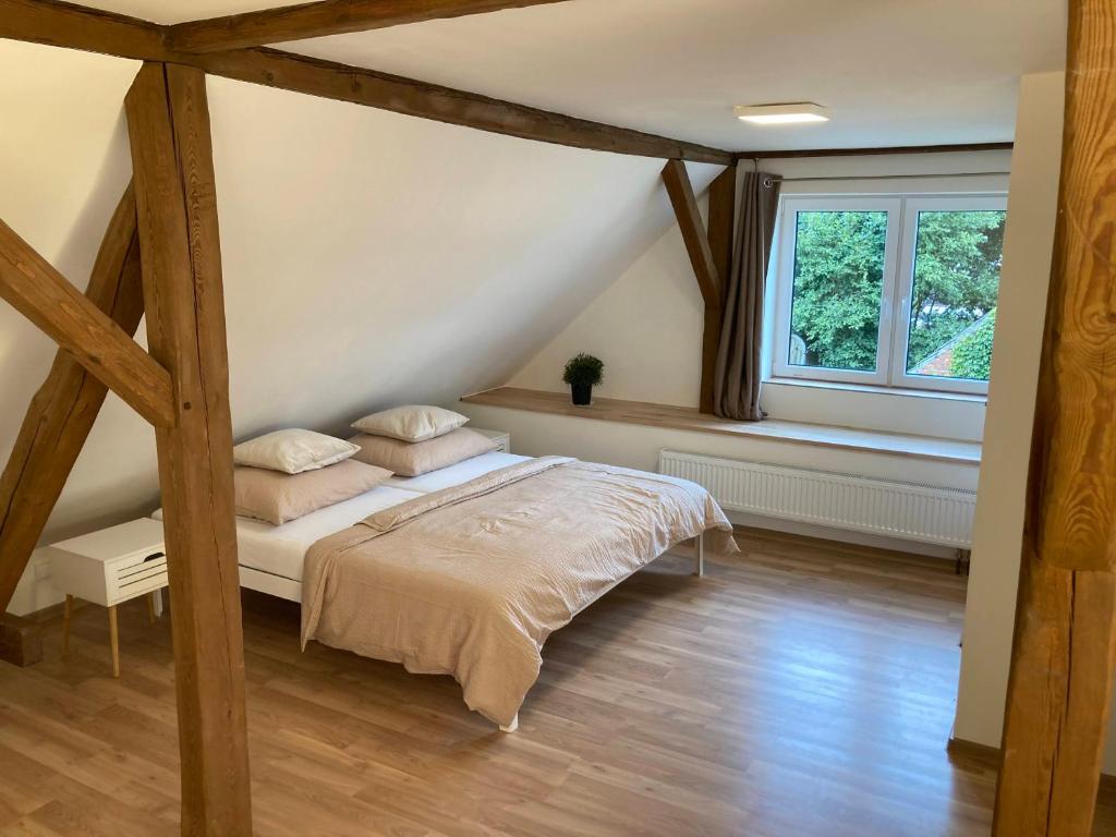 Postel nebo postele na pokoji v ubytování Apartmány u řeky Nežárky