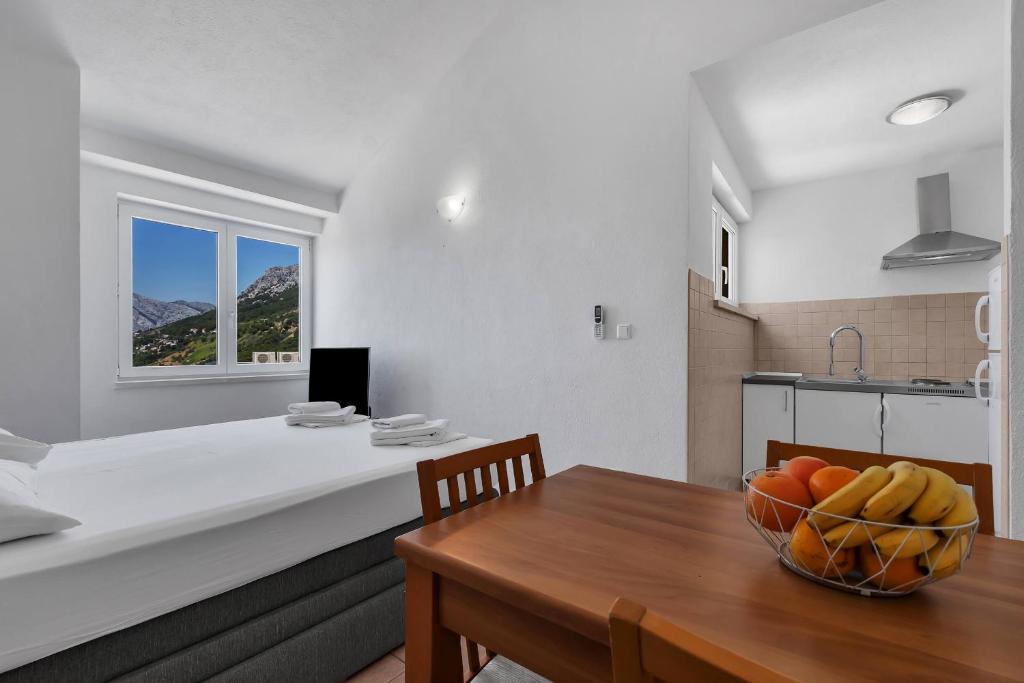 Kuchyň nebo kuchyňský kout v ubytování Apartments Marin