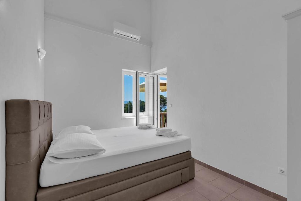 Postel nebo postele na pokoji v ubytování Apartments Marin