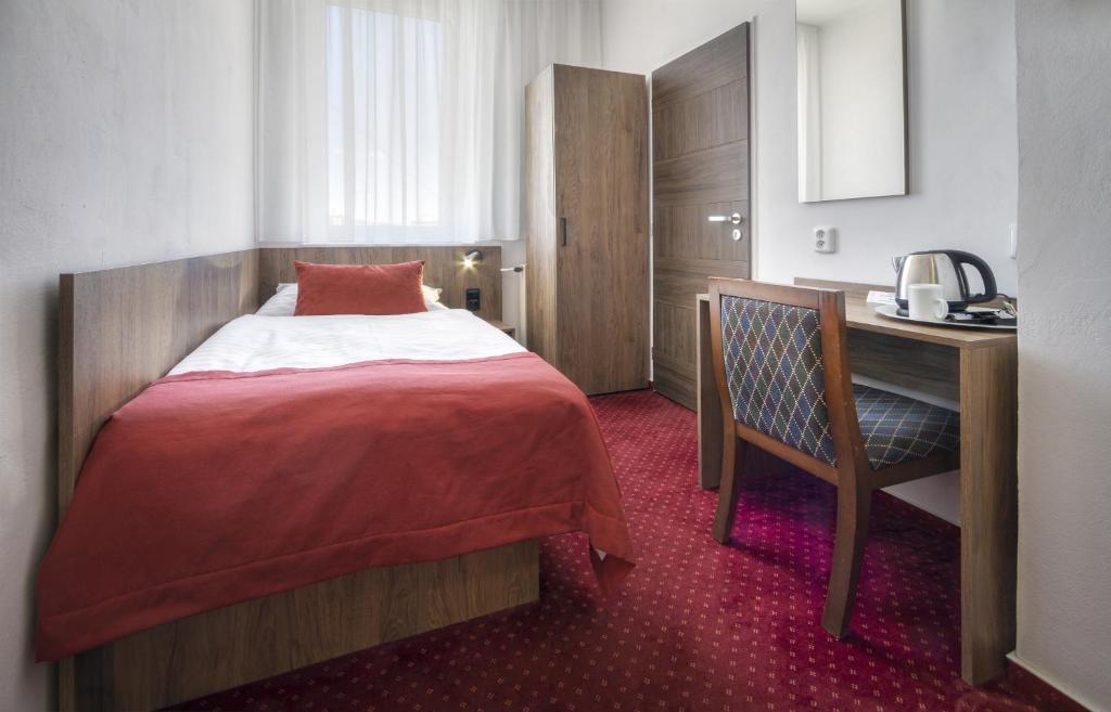 Postel nebo postele na pokoji v ubytování Hotel Harmony