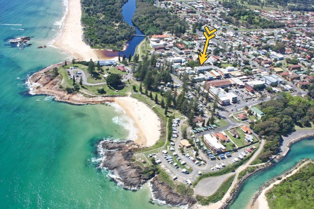 an aerial view of a resort on a beach at Rockleigh in South West Rocks