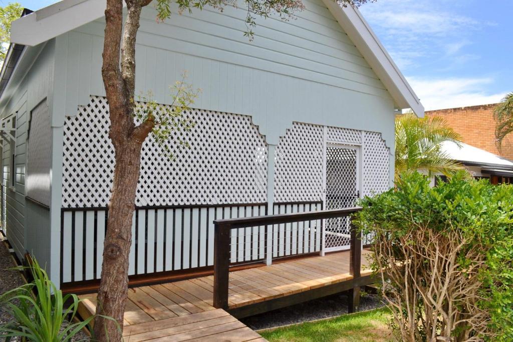 a deck with a fence on a house at Rockleigh - Bring your own linen. in South West Rocks
