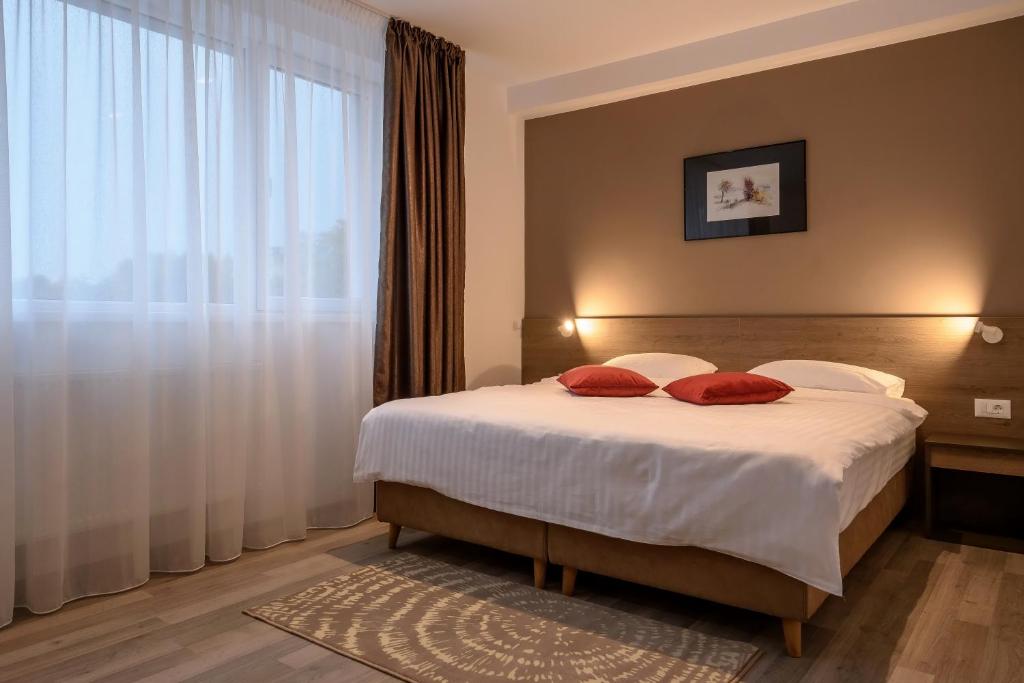 Un pat sau paturi într-o cameră la VMD Residence