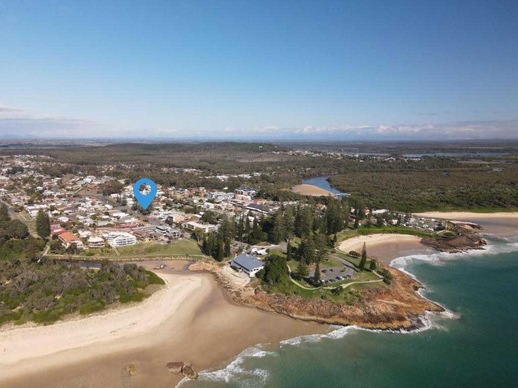 an aerial view of a beach with a hot air balloon at Village Centre 3 South West Rocks in South West Rocks