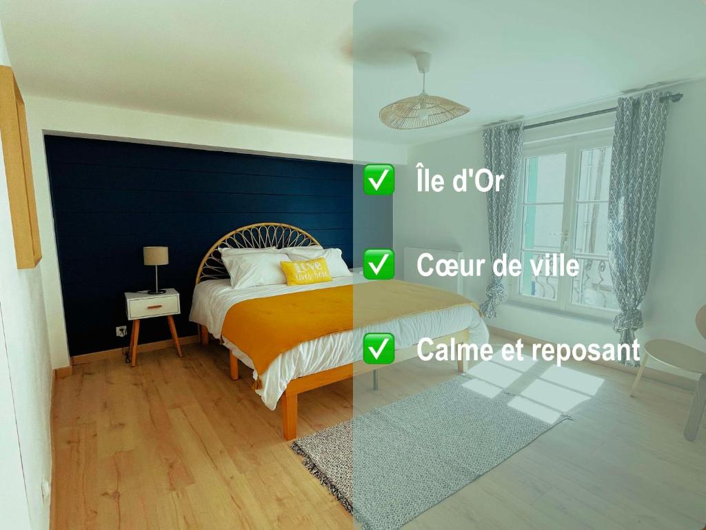 1 dormitorio con cama y pared azul en Amboise - L'écrin de Léonard, en Amboise