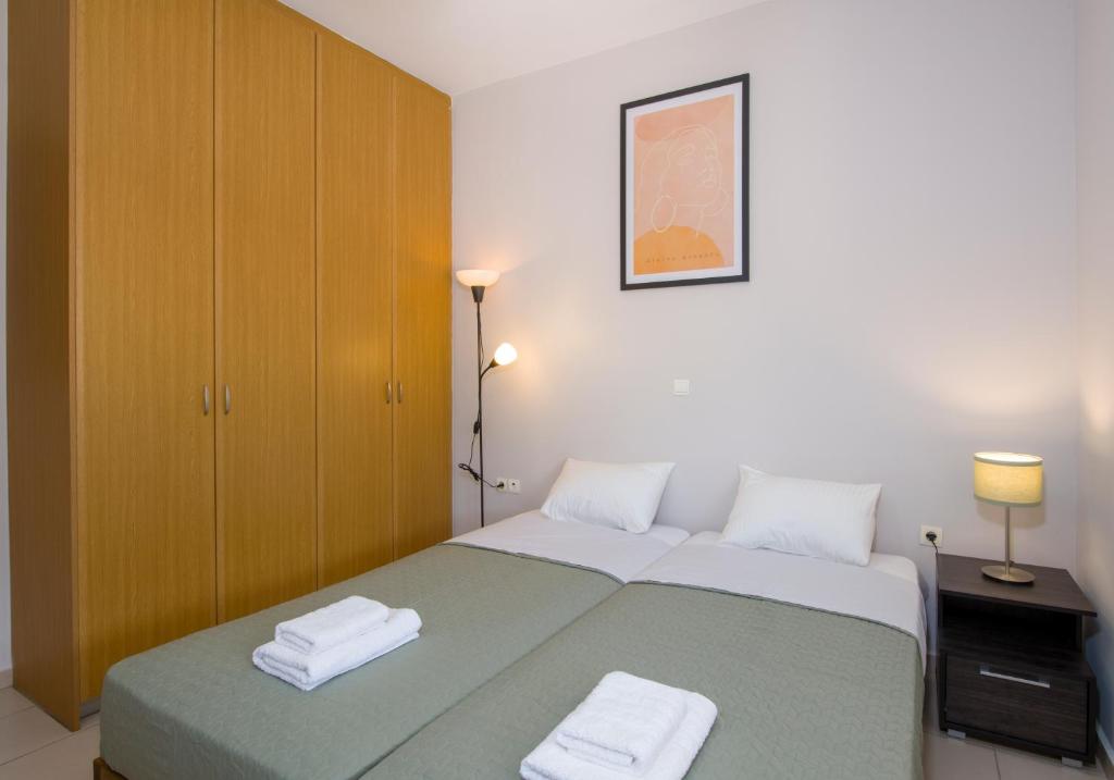 Postel nebo postele na pokoji v ubytování Peris House Souda