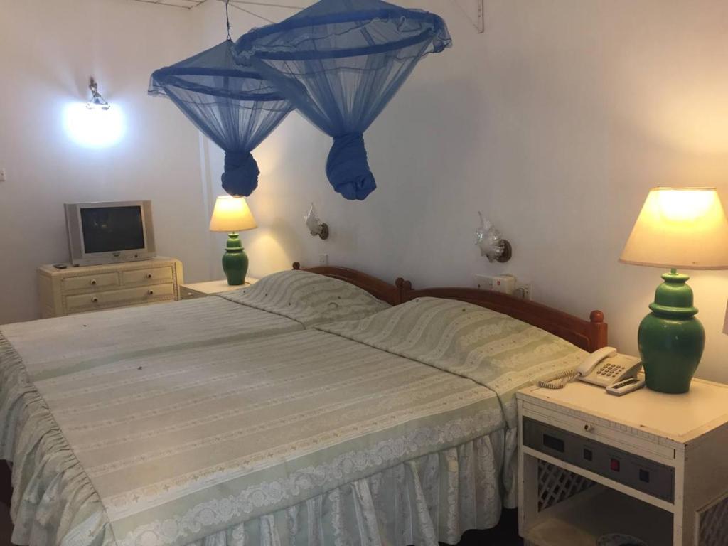 Postel nebo postele na pokoji v ubytování Hotel Shalini