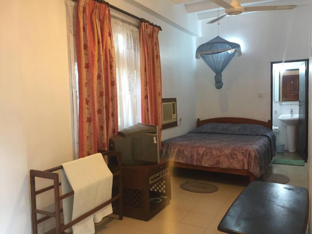 Postel nebo postele na pokoji v ubytování Hotel Shalini