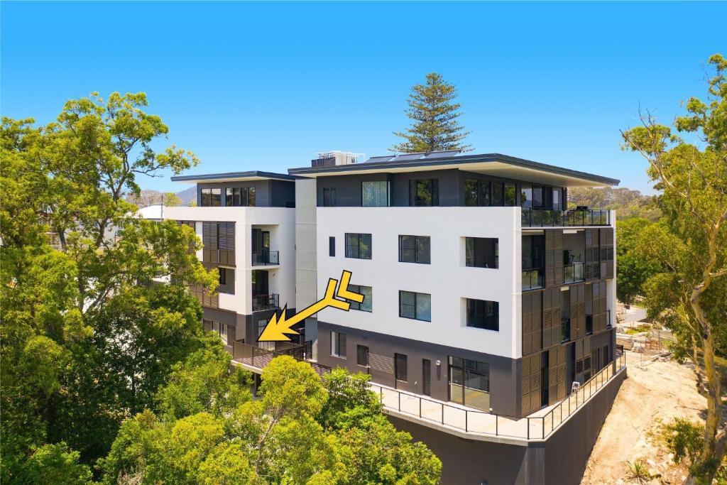 a building with a tree on top of it at Nineteen On Gregory G02 in South West Rocks