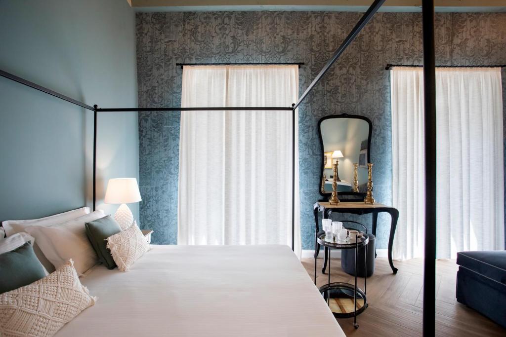 Postel nebo postele na pokoji v ubytování Vossia Luxury Rooms & Sicilian Living