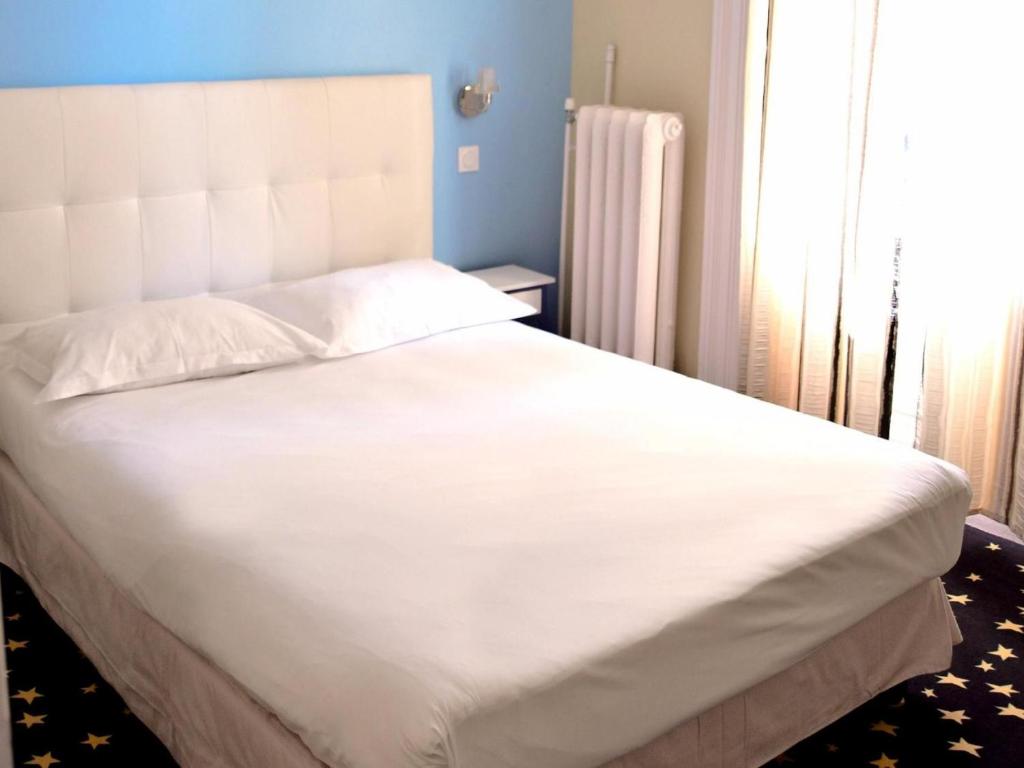 Postel nebo postele na pokoji v ubytování Hotel Le Comty