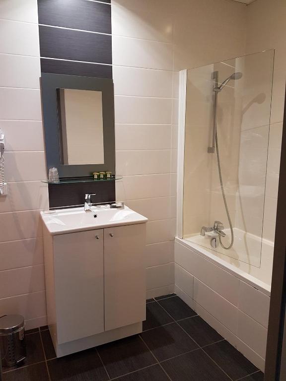 Koupelna v ubytování Hotel Le Comty