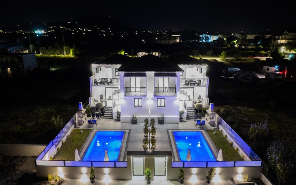 an aerial view of a house with two swimming pools at Eagle's Nest - Adjoining Villas! in Tsilivi