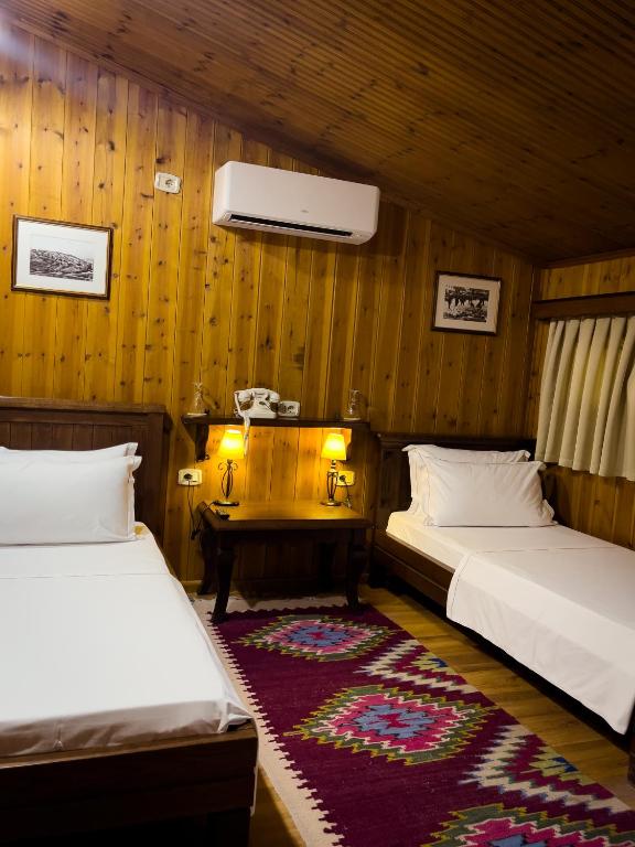 Letto o letti in una camera di Hotel Mangalemi
