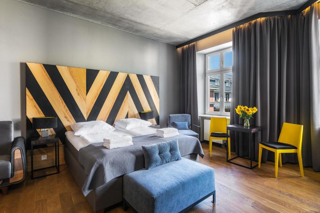 En eller flere senger på et rom på Dada Premium Aparthotel