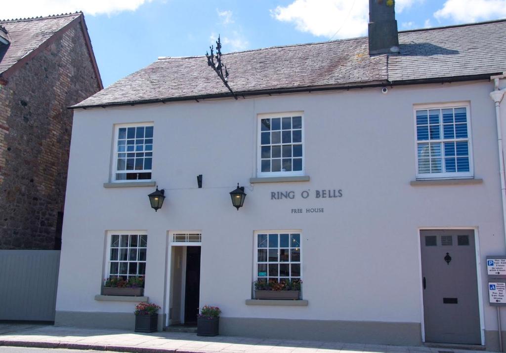 a white building with the king of hawkes written on it at Ring O Bells in Chagford