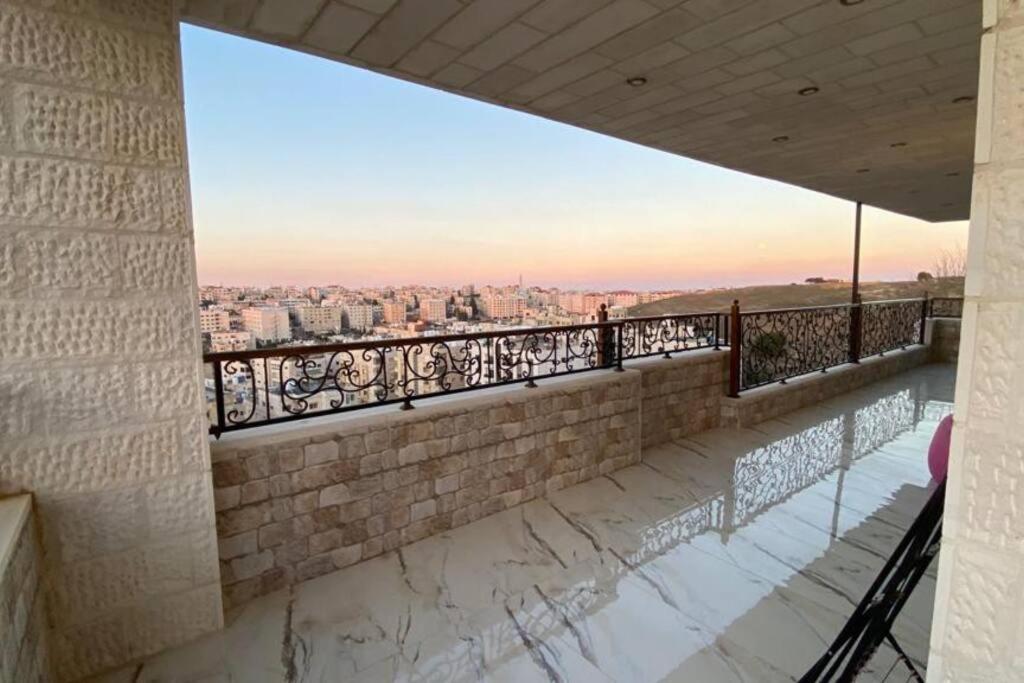 a balcony with a view of a city at Beautifull Rooftop with an Amazing Terrace View in Amman