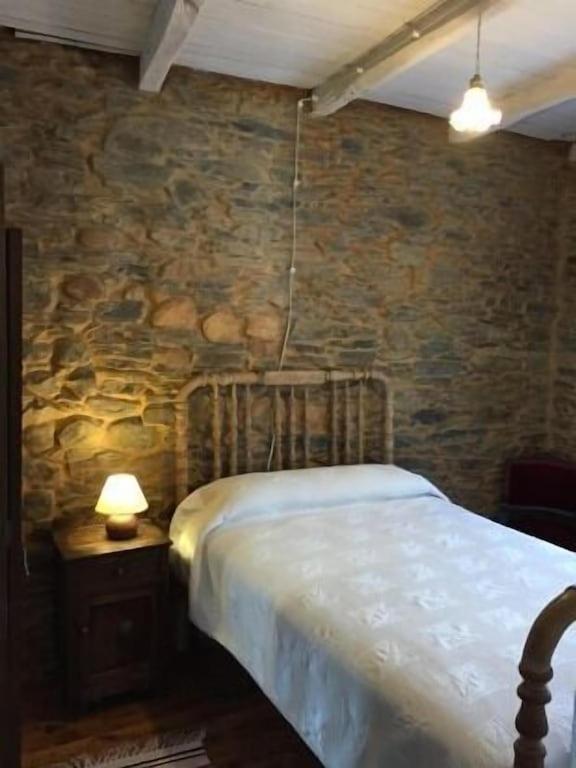 Postel nebo postele na pokoji v ubytování Casa rural **** El Barreiro. Ideal para familias.