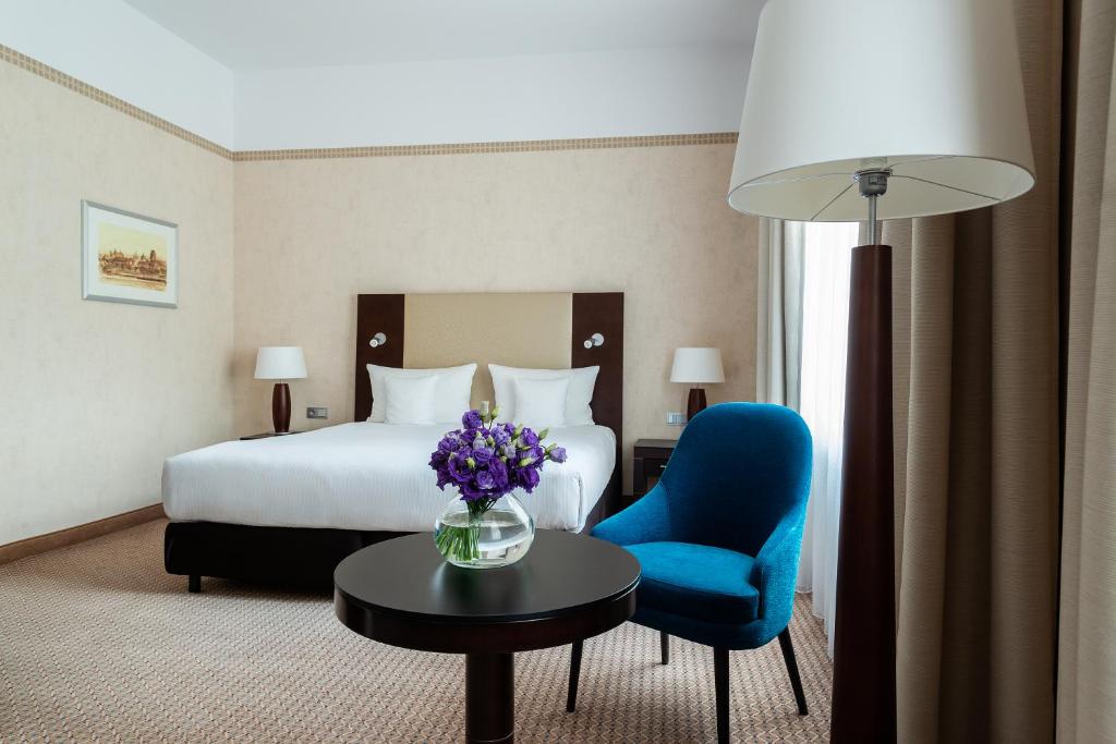 Posteľ alebo postele v izbe v ubytovaní Hotel Polonia Palace