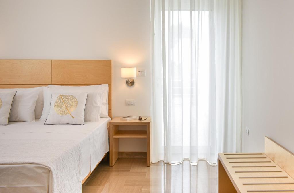 A bed or beds in a room at Ammarèa B&B