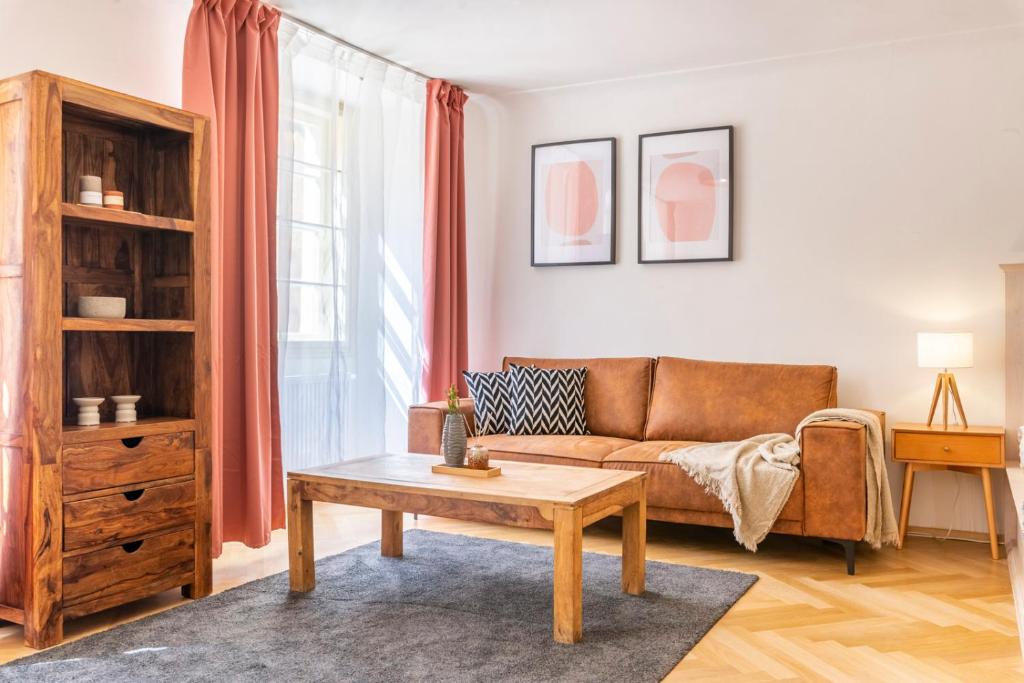 a living room with a couch and a coffee table at Celetná 12 - Old Town Residence in Prague
