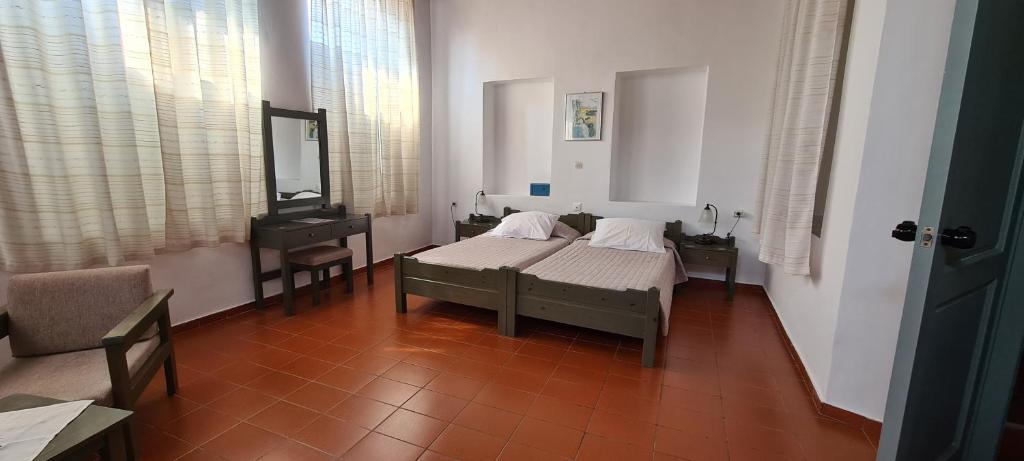 Postel nebo postele na pokoji v ubytování Vecchio Hotel