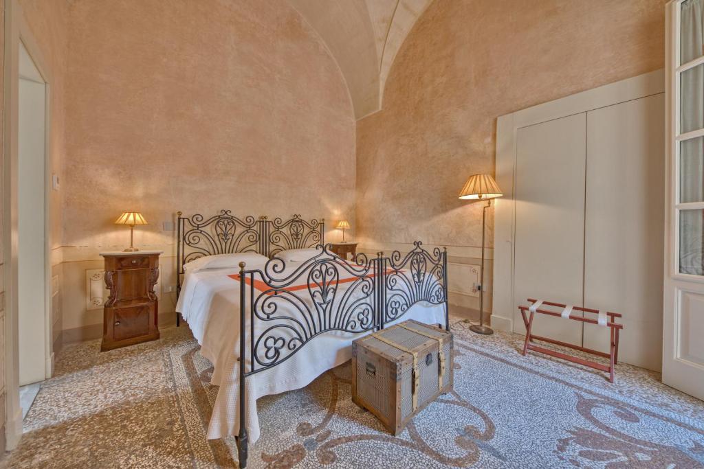 Postel nebo postele na pokoji v ubytování Palazzo Mosco - Dimora Storica