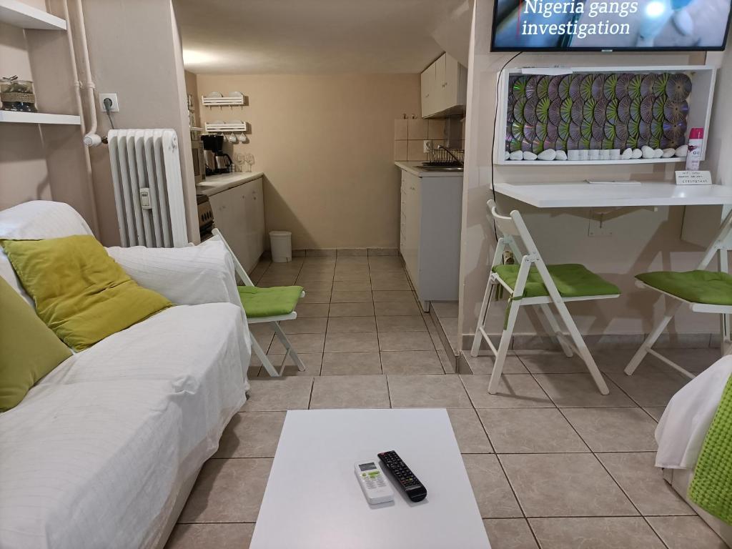 Televízia a/alebo spoločenská miestnosť v ubytovaní The Urban Escape