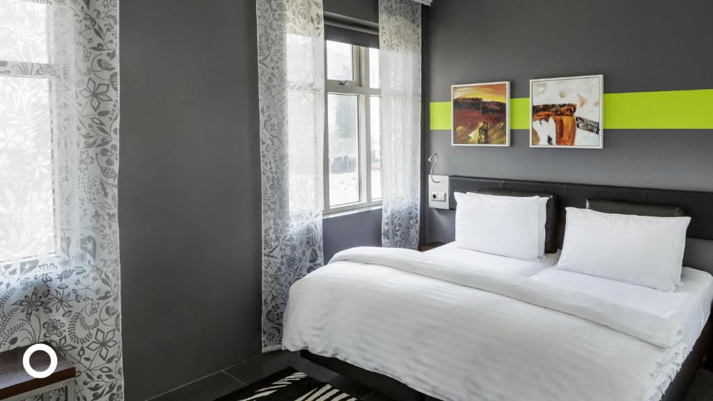 Postel nebo postele na pokoji v ubytování Center Hotels Arnarhvoll