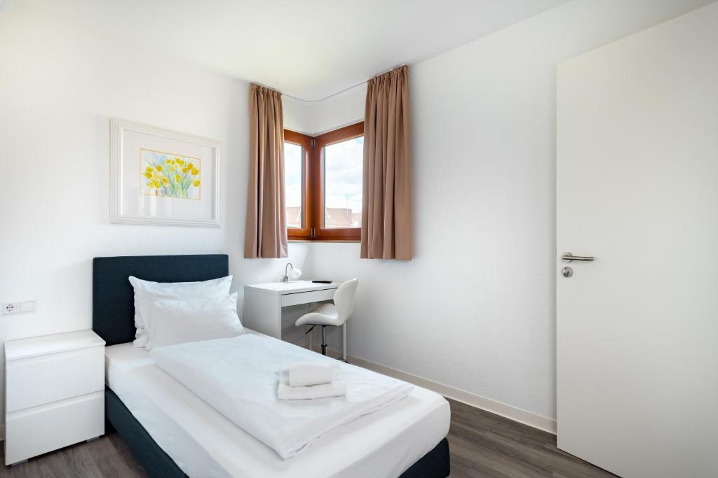 Postel nebo postele na pokoji v ubytování Hotel Garni am Olgaeck