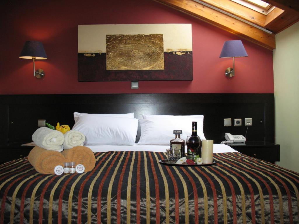 Postel nebo postele na pokoji v ubytování Hotel Prigipikon Suites and sofites