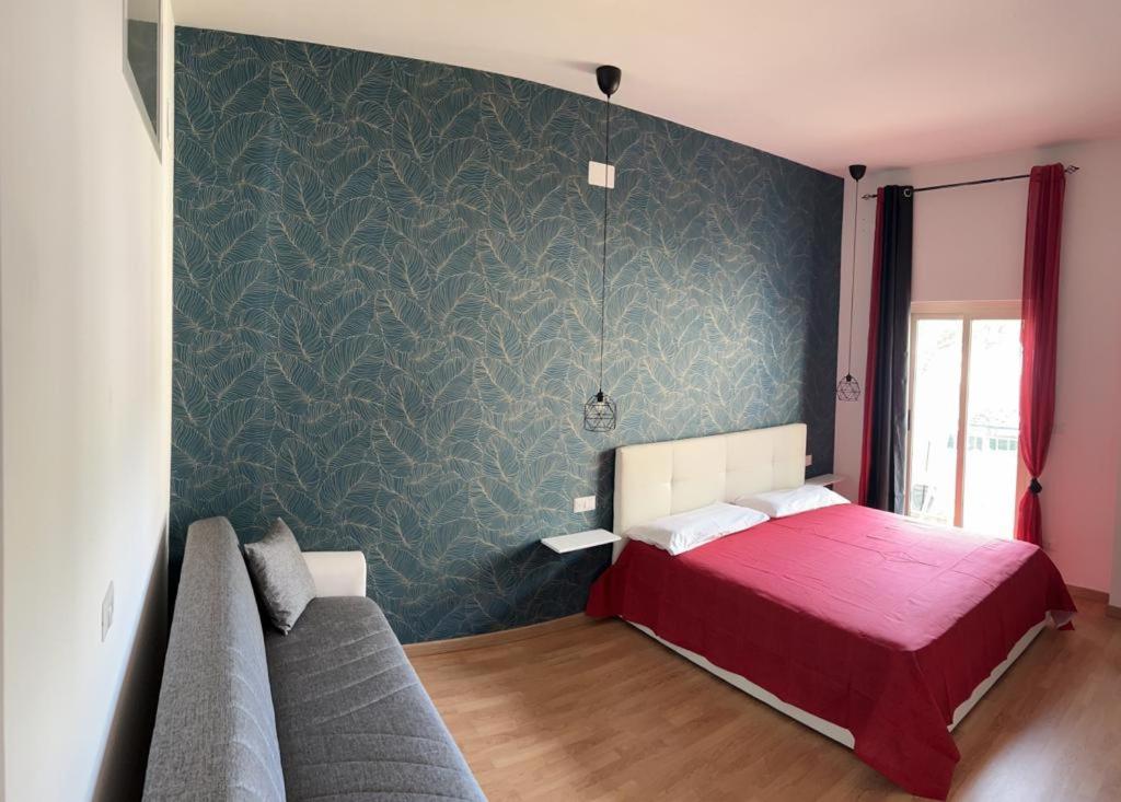 A bed or beds in a room at Casa di Charlie