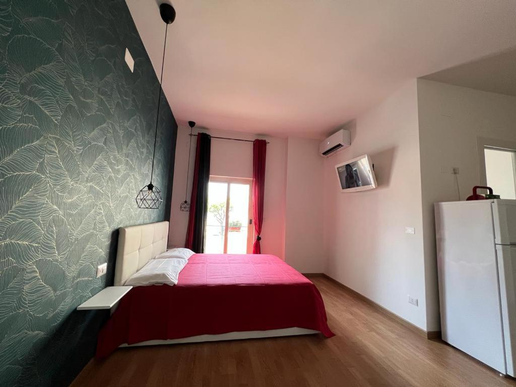 A bed or beds in a room at Casa di Charlie