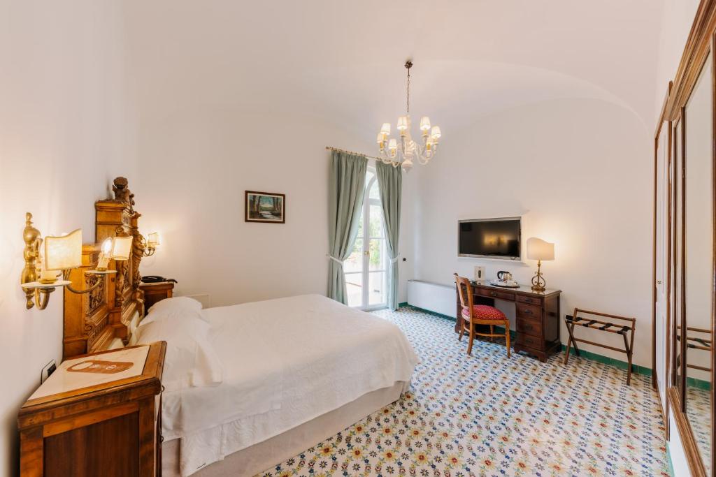 Postel nebo postele na pokoji v ubytování Hotel Giordano