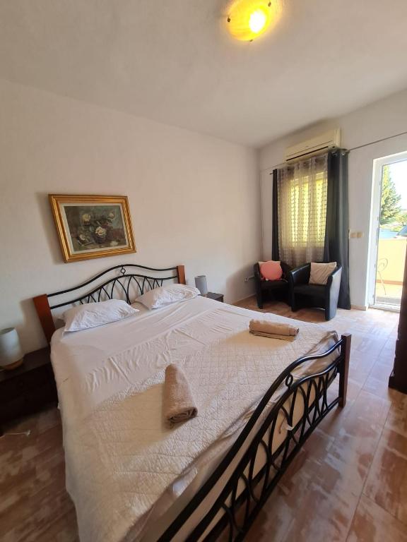 Postel nebo postele na pokoji v ubytování Apartmani Levarda