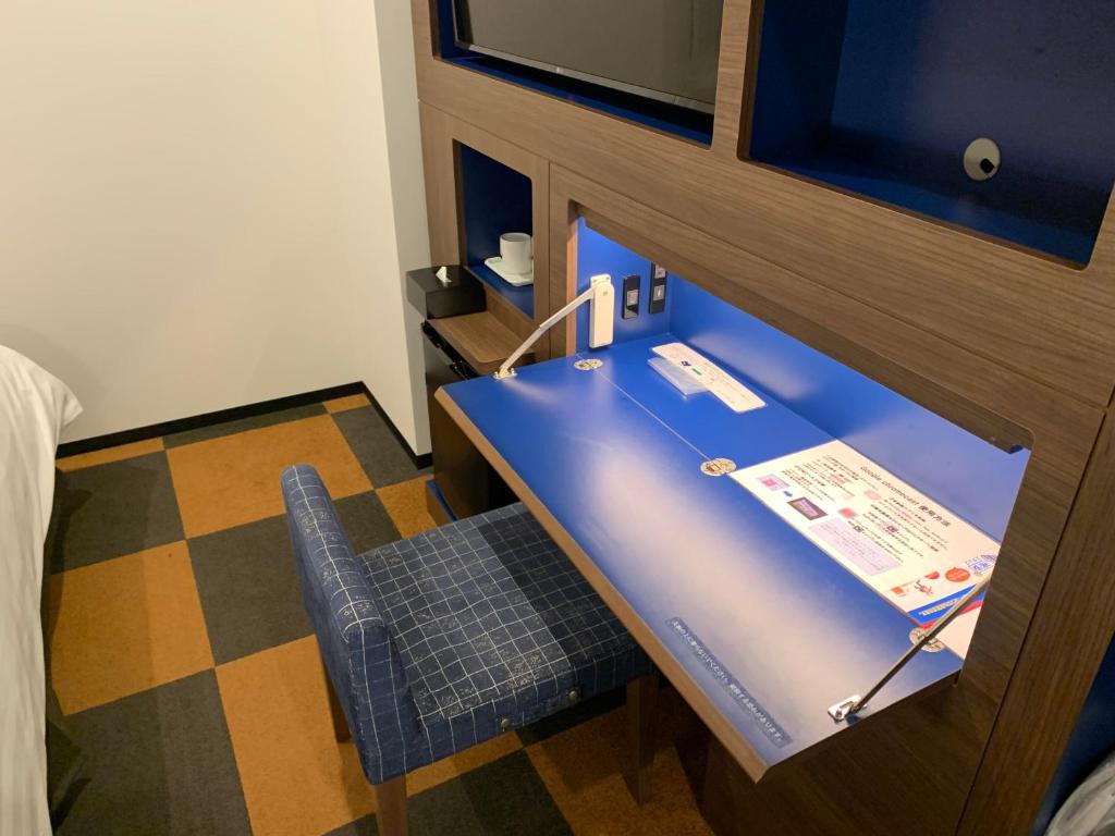 Televiisor ja/või meelelahutuskeskus majutusasutuses Henn na Hotel Tokyo Haneda