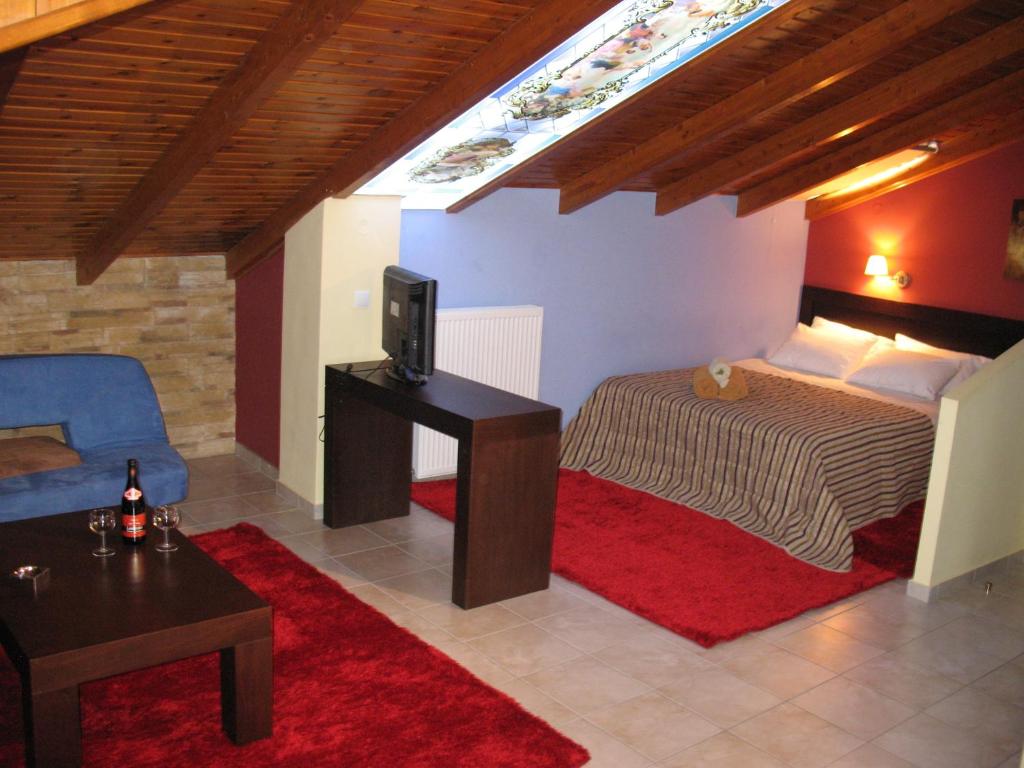 Postel nebo postele na pokoji v ubytování Hotel Prigipikon Suites and sofites