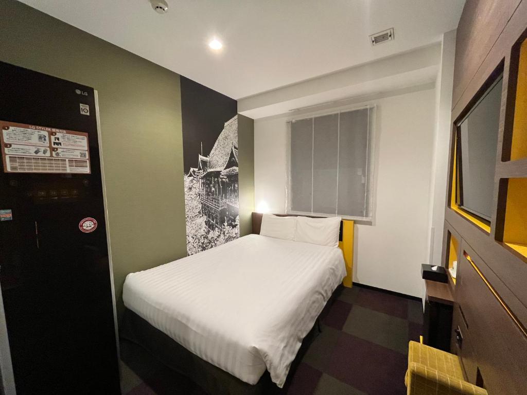 Voodi või voodid majutusasutuse Henn na Hotel Tokyo Haneda toas